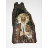 A Russian icon depicting St Iwan, length 20cm.