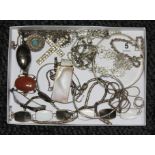 A tray of assorted jewellery, comprising pendants, chains, bangles, bracelets, many items marked '