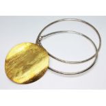 A Polish contemporary silver smooth link necklace with silver gilt disc pendant.