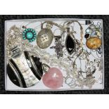A tray of assorted jewellery comprising a multi-gem pendant set with fossilised coral,