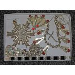 A tray of assorted costume jewellery including a marcasite and black slab set bracelet marked '925',