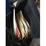 A leather bag containing sheet music.