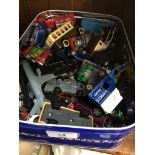 A tin containing various die-cast vehicles, Matchbox, Corgi, Days Gone By, etc.