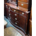 A reproduction mahogany serpentine front sideboard.