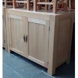 A modern light oak sideboard.