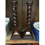 Pair of barley twist wooden candlesticks.