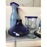 Four pieces of blue glass