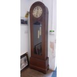 An early 20th century oak long cased clock.