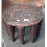 An African carved wood stool.