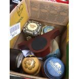 A box of misc. including a Committi of London clock, another clock, various tins and a Russian doll.