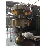 A metal Tiffany style ceiling light / fan.