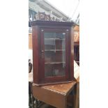 A Georgian oak corner cabinet.