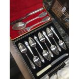 A cased of of silver plated grapefruit spoons and knife, together with a cased silver plated