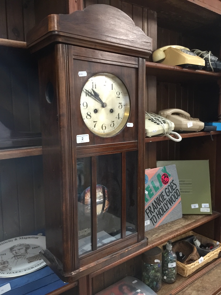 A wall clock with pendulum - no key.