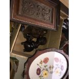 A box of treen and similar carvings including a continental nut cracker etc.