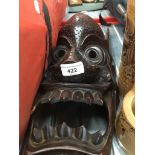 An eastern carved wood mask.