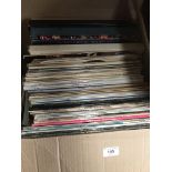 A box of assorted records, LPs and 45s.