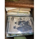A box of vintage postcards.