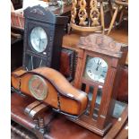 Two early 20th century oak cased wall clocks and an early 20th century mantle clock.