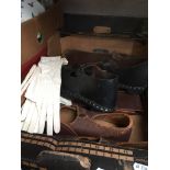 A box containing 2 pairs of Lancashire clogs and leather music case.