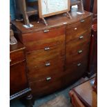 A reproduction bow front chest of drawers.