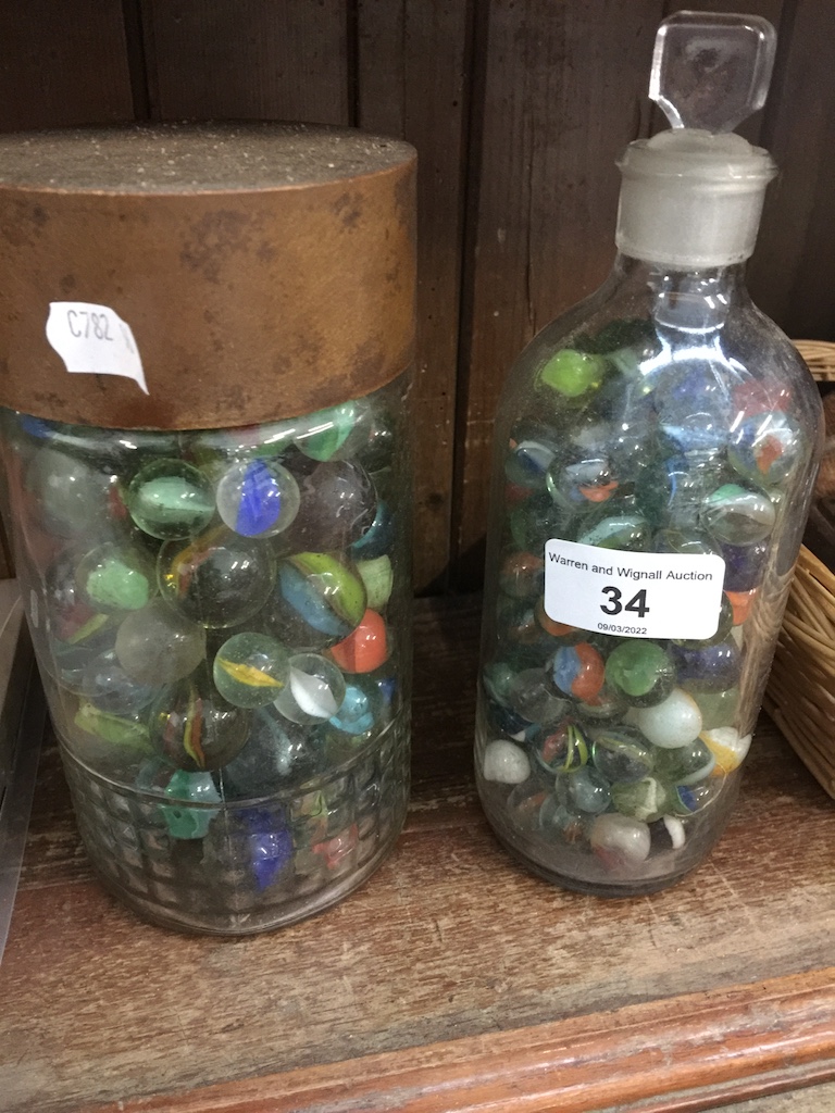 2 jars of various marbles.