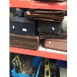 4 vintage suitcases and 3 briefcases.