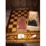 A Staunton boxed wood chess set and a marquetry chess board.