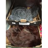 2 boxes of fur collars and fur hats.