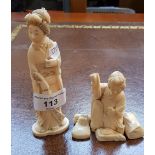 Two Japanese ivory figurines.