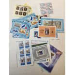 A selection of mint condition world postage stamps commemorating royal events etc