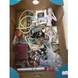 A box containing costume jewellery, collectables, picture frames, pincushion dolls etc