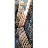 2 bundles of stair spindles and a newel post