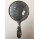 A hallmarked silver backed hand mirror with monogram NC?