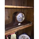 A domed top mantle clock.