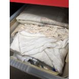 A large box of linen and lace including silk shawl.