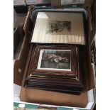 A box containing various pictures, prints, etchings etc.