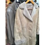 A sheepskin jacket, size UK 16 and a leather jacket, size M.