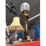 A brass Corinthian column oil lamp (converted to electric).