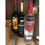 A bottle of J&B 1L blended scotch whisky, a bottle of Smirnoff vodka and a bottle of Spanish red