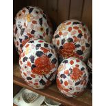 Four repro porcelain large egg ornaments