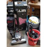 A Kirby Avalir vac cleaner with tools and an Earlex combi vac with accessories.