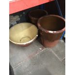 Three glazed terracotta pots.