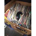 A box containing approx 300 singles including, Fleetwood Mac, Tears for Fears, picture disks, etc