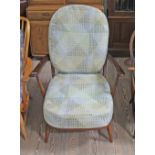 A vintage Ercol dark elm 'Fleur de Lys' armchair. Good overall, some marks and light surface