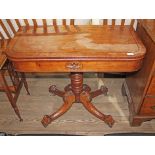 A Regency rosewood fold-over card table, frieze with card oval, turned pedestal, four out-splayed