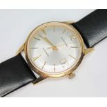 A hallmarked 9ct gold Garrard automatic wristwatch, case diameter 33mm, later leather strap, with