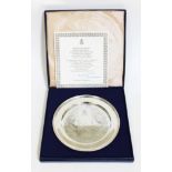 A silver plate commemorating the silver wedding of Queen Elizabeth II and Prince Philip with