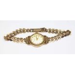 A 9ct gold rotary wristwatch with 9ct gold strap, gross wt. 11.48g.