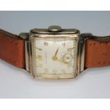 A 1940s Longines 10K gold filled watch, Art Deco style, curved rectangular case width 25mm, signed